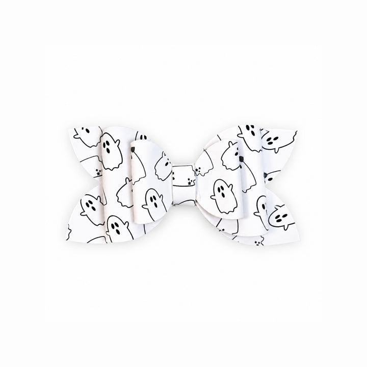 A white faux leather hair bow with a black outline print of cute cartoon ghosts, shown against a plain white background.